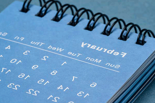 Detail photo of a calendar with dates and the month of February.